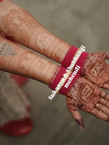 A beautiful shot showing the bride's hands after the stain has set, featuring custom elements like wedding rings and initials.