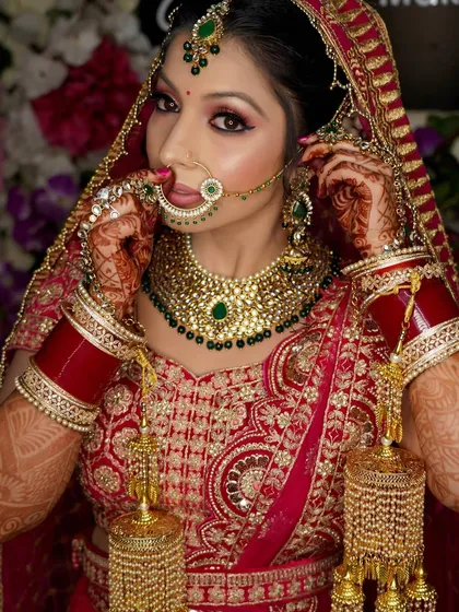 A portrait capturing the bride adjusting her nose ring. These small, detailed actions make for beautiful and natural bridal photos.