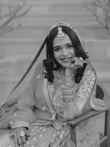 A joyful black and white portrait. The bride's happy, relaxed smile makes this a heartwarming and beautiful image.