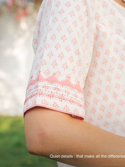 Quiet details make all the difference. This close-up shows the tanka stitches and contrast trims on the sleeve of a Suhani Appliqué top, details you only notice up close that bring the piece together.