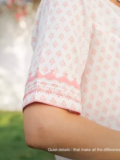 Quiet details make all the difference. This close-up shows the tanka stitches and contrast trims on the sleeve of a Suhani Appliqué top, details you only notice up close that bring the piece together.