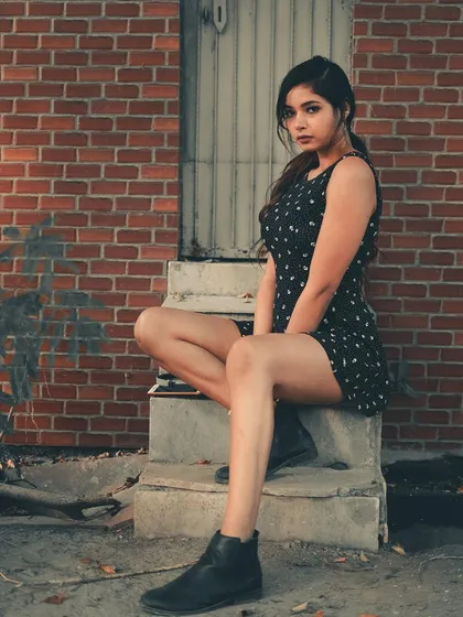 A simple brick wall and concrete steps can make for a great portrait location. The textures and tones create a classic urban feel that lets the subject be the main focus.