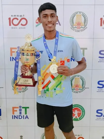 Our champion, Ramchandra Sitaram Zore, holding the gold medal and trophy after a spectacular win at the Khelo India Youth Games in Madurai. We train our athletes to excel on the national stage.