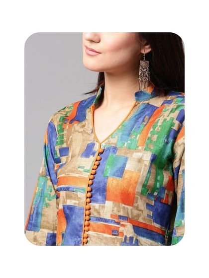 This image showcases a V-neckline on a printed kurti, enhanced with a line of small, decorative potli buttons along the collar. It's a simple way to add a unique touch to your tailored outfit.