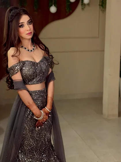 A full-length shot of the Roka bride. The entire look is modern, chic, and perfect for a young bride.