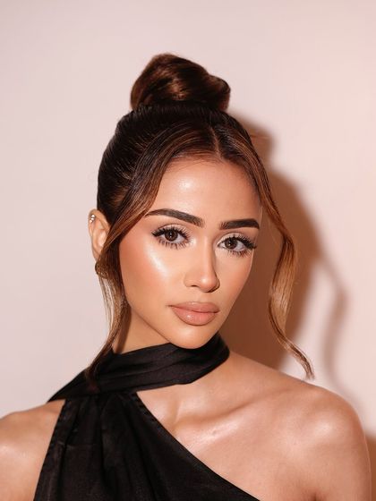 A stunning portrait. The makeup is clean, fresh, and all about that glow.