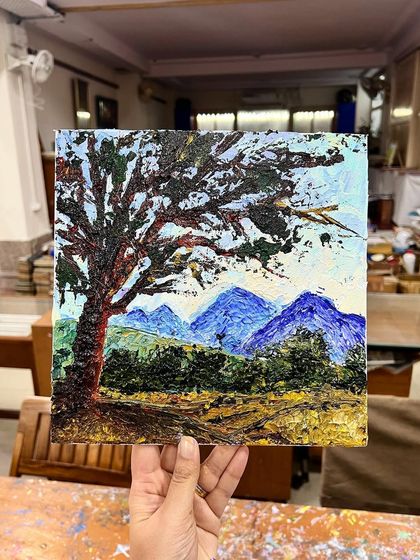 A stunning landscape created with a palette knife, showcasing a textured tree against distant mountains. This piece was made during one of our offline classes in Delhi.