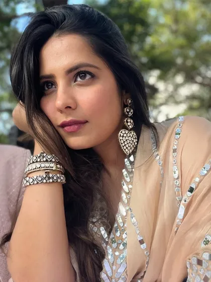 In my soft girl era with this dreamy pastel lehenga and heart-shaped earrings. This is a perfect look for a daytime wedding or a romantic outdoor event.