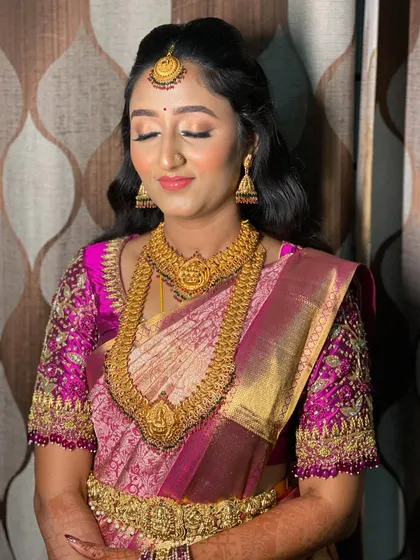 Eyes closed, this shot gives a great view of the soft, neutral-toned shimmer on the eyelids, a perfect choice for a sophisticated evening look.