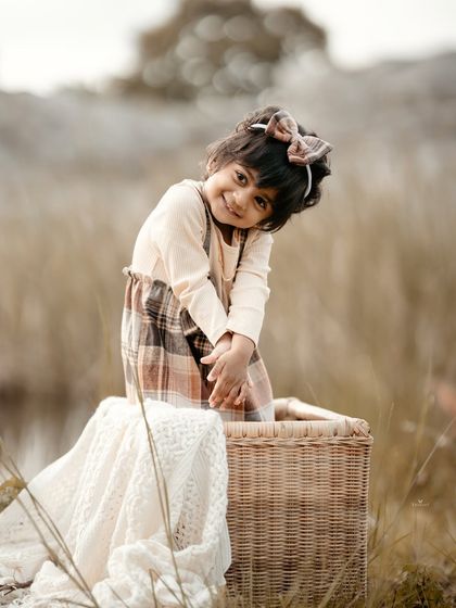 A charming, tilted-head pose that perfectly captures her adorable personality.