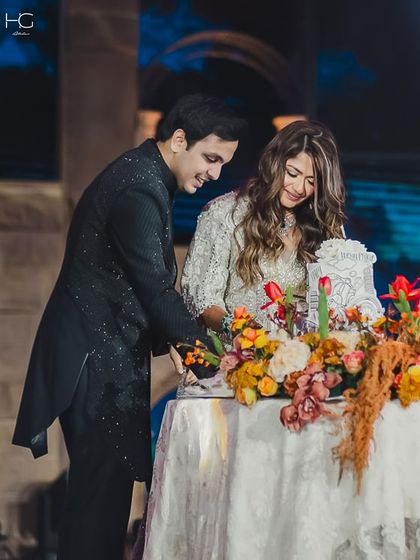 Another candid moment from the celebration, showing the groom, Piyush Bansal, in his embroidered sherwani. It's designed to look impeccable even in motion.