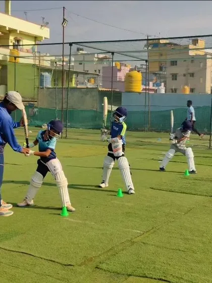 Discipline and teamwork are at the heart of our training. This image captures our young batsmen lined up, focused and ready for their drills. We instill a sense of order and purpose in every session, preparing them for the structured environment of a real match.
