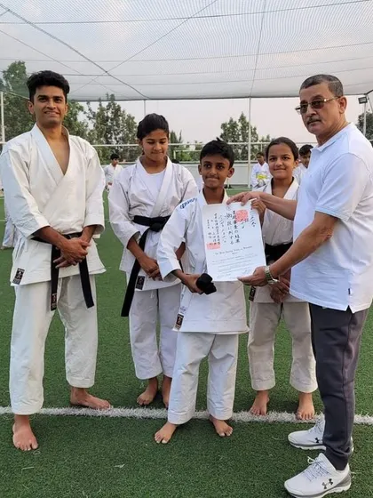 A proud moment as a student receives his official black belt (Shodan) certificate, sent all the way from the WSKF headquarters in Tokyo, Japan. This is the culmination of years of dedication.