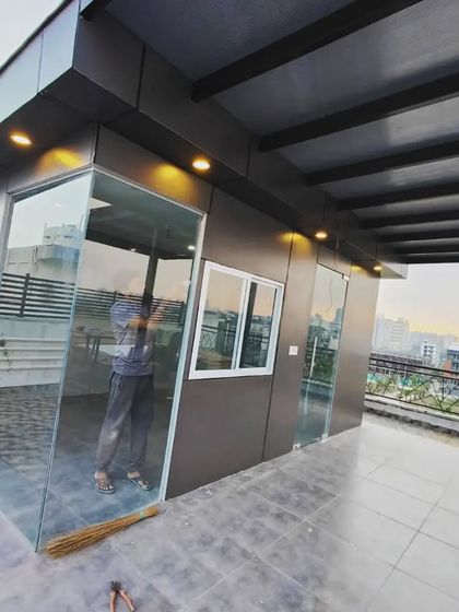 The same modern prefab room at night, with exterior lights highlighting its clean lines and contemporary design.