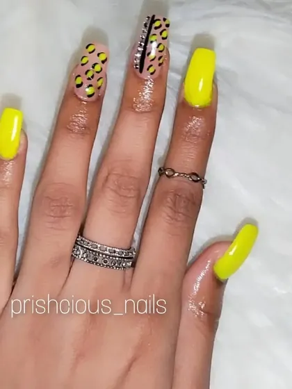 The full view of the neon yellow and leopard print square-shaped extensions.