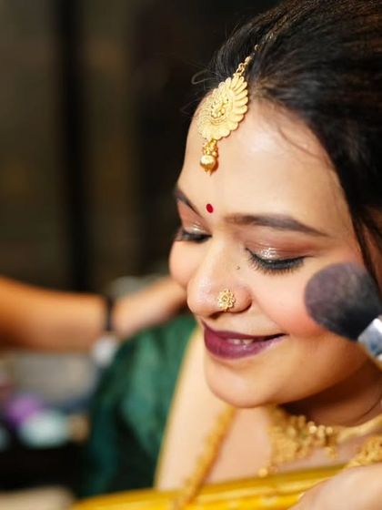 A behind-the-scenes shot of the baby shower makeup application. This shows the gentle and precise technique I use for all my clients.