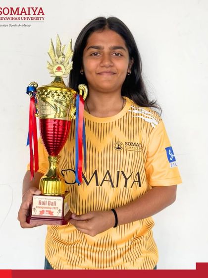 Jidnya Mandar Sawant holds the third-place trophy her team won at the 19th Junior Maharashtra State Roll Ball Championships.
