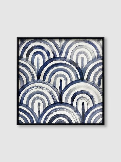 This geometric pattern of indigo arches is given a crisp, graphic look with our thin black metal frame, making it a perfect piece for a modern interior.