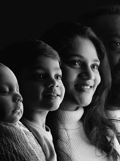 A creative black and white family portrait showcasing four generations of love in a single, artistic composition. This is an example of how we can create a truly unique piece of art for your family.
