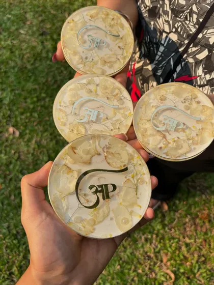 These 4-inch coasters were made with a custom logo and preserved flowers. They are a great way to turn a special memory into a functional item for your home or office.