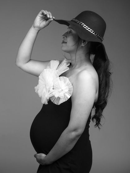 A chic and stylish black and white portrait. The addition of a hat gives the classic Veneccia gown a modern, fashionable edge.
