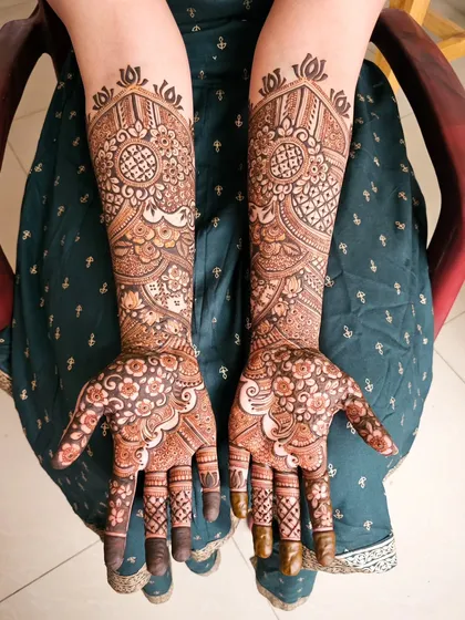 Another view of the floral mandala design, showing the symmetry on both hands.