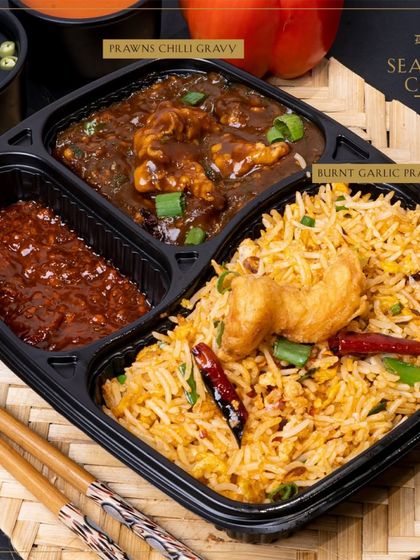 A seafood lover's dream combo. This meal includes our aromatic Burnt Garlic Prawns Rice paired with a spicy Prawns Chilli Gravy.