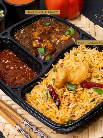Our Seafood Combo features delicious Burnt Garlic Prawns Rice, a flavorful and aromatic delight for seafood lovers.