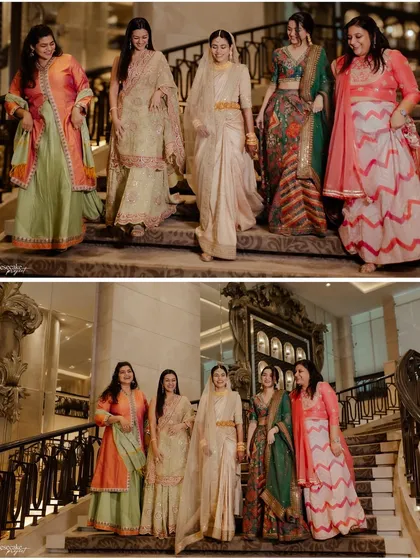 The bride and her bridesmaids making a stylish entrance down the grand staircase.