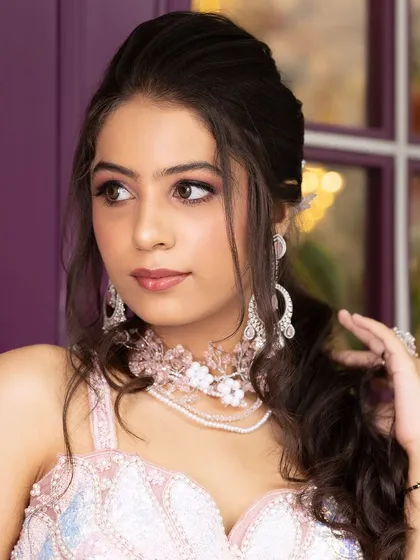 A series of portraits from an engagement shoot, featuring a model in a pink lehenga and modern jewellery. This is a great reference for a soft, romantic look.