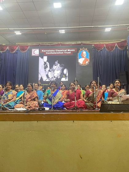 A wide shot of a large group of musicians on stage for a festival in Mysore. These grand ensembles, featuring many instruments, create a rich and powerful sound.