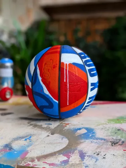 I can paint on pretty much anything. It was a blast to create this custom basketball for an NBA and Budweiser event, mixing my graffiti style with the energy of the game.