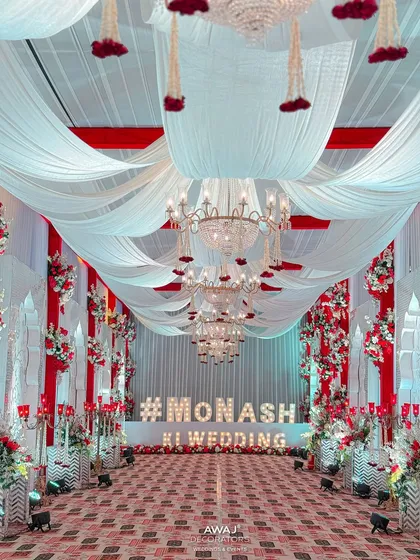 The end of the grand walkway, featuring a large marquee sign with the couple's wedding hashtag.