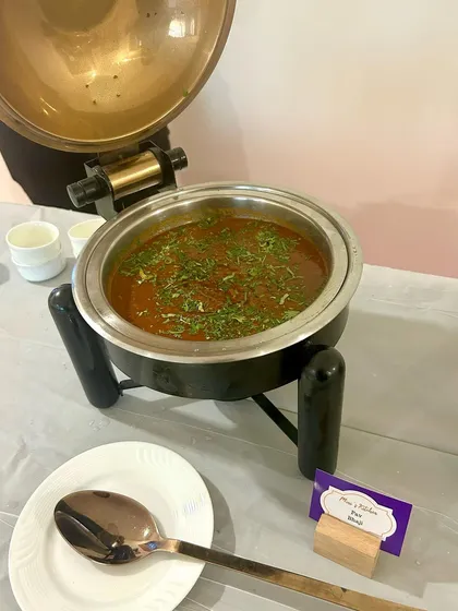 My signature Dal Makhani served in a traditional copper pot. This dish is a crowd favorite and a staple of my North Indian buffet menu.