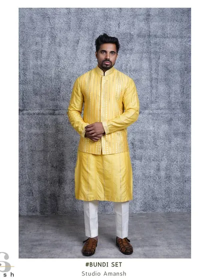 Our canary yellow bundi set is made for vibrant celebrations like a haldi ceremony. The jacket and kurta feature delicate gota embroidery for a touch of traditional shine.