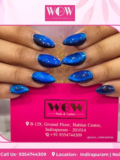 Dive into the deep blue with this incredible cat-eye manicure. The magnetic polish creates a vibrant, shimmering effect that looks like a galaxy on your nails.