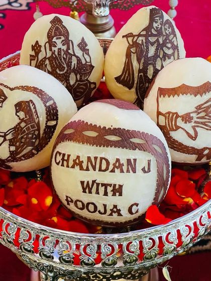 The small details matter the most. I offer personalized coconut carving for engagements and weddings, featuring the couple's names and traditional designs. It’s a unique touch that clients always love.