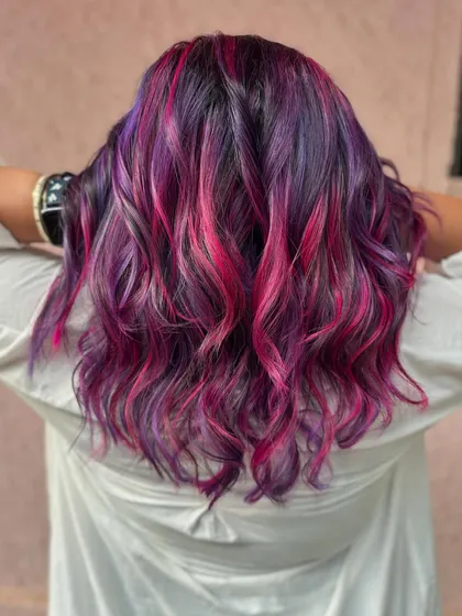 The back view of this stunning purple and pink hair. The colors are bold, bright, and beautiful.