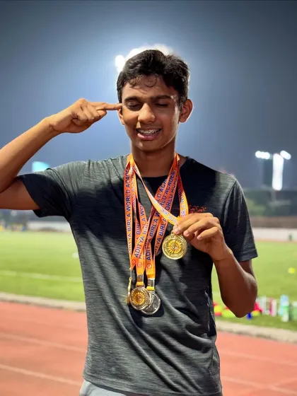 The mindset of a champion. Ishaan Bhartiya pointing to his head, signifying the mental toughness required to win four medals at a single event.