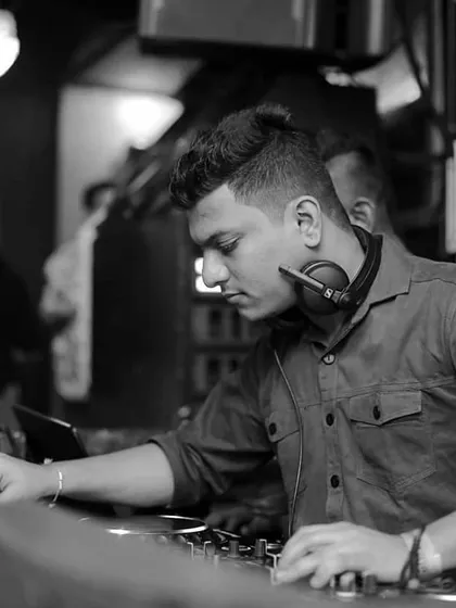 A profile shot showing my concentration while mixing. Being a DJ is about the art of blending sounds and creating a continuous flow of music.