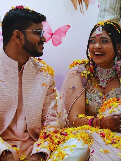 Another beautiful shot of the couple enjoying the 'phoolon ki holi' during their Haldi. The air was filled with laughter and the sweet scent of fresh flowers.