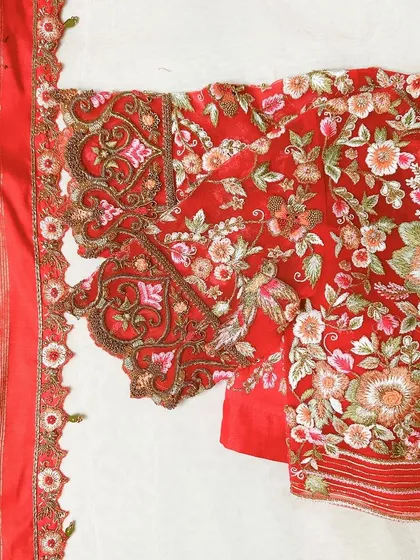 A closer look at the heart of my craft. This blouse sleeve, crafted on delicate net fabric, is a canvas of dense floral and bird embroidery. I used scalloped cut-work techniques to create a soft, elegant edge, making this piece a true tribute to the art of hand embroidery.