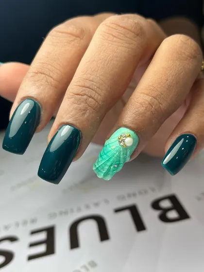 Another angle of the deep teal gum gel extensions with the hand-sculpted seashell art. This demonstrates how I can combine simple, glossy color with intricate, textured accent nails.