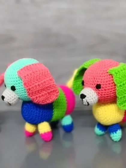 A row of four colorful sausage dogs, each one unique.