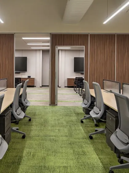 The training rooms at the Carlsberg office shown with partitions closed, creating separate, focused environments. This highlights the flexibility of the design, allowing for both large-scale events and smaller, private sessions.