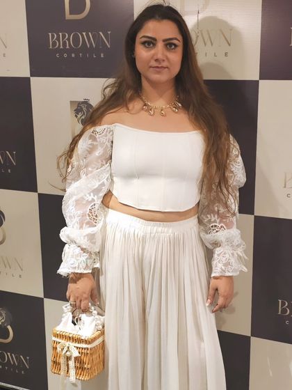 Life is a party, dress like it. Here I am at 'The White Party' at Brown Cortile Delhi, wearing a beautiful white co-ord set accessorized with our statement necklace and a cute basket bag.