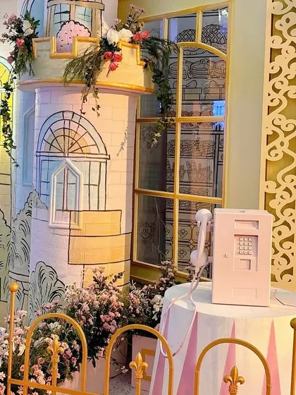 A close-up of the hand-drawn building facades, showing the artistic detail that goes into each custom prop.
