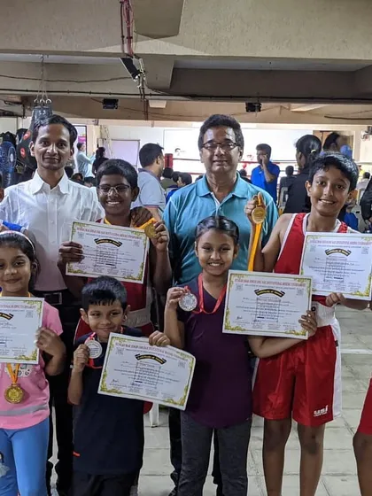 Our youngest group of boxers showing off their certificates and medals after a successful tournament.