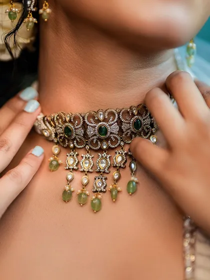 Details matter. This close-up on an ornate choker necklace shows our focus on accessory and jewelry photography. We ensure every element of the styling, from the main outfit to the smallest accessory, gets its moment.