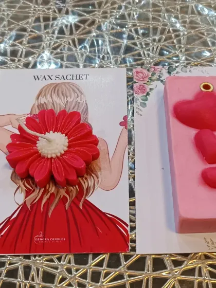 In addition to floral shapes, I also make other designs like this pink bar with small hearts. Next to it is a red flower sachet, showcasing the variety in my collection.